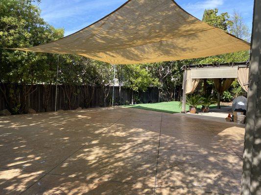 stamped concrete, artificial turf and shade