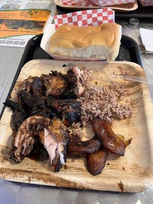 Jamaican Jerk chicken. Rice. Fried plantains. Coco Bread.