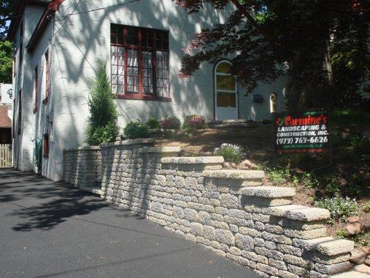 Installation of a Techo-bloc retaining wall.