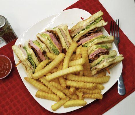 Club sandwich with fries