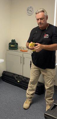 Instructor Paul showing us how to safety hold a hand gun.