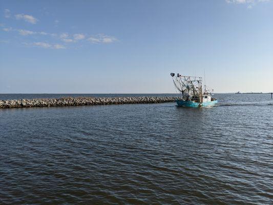 Shrimp boat heading out from Ocean Springs Harbor: