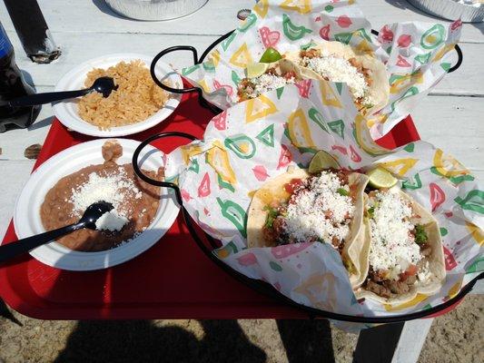 Tacos with flour tortillas (queso fresco added), an order of rice, order of beans