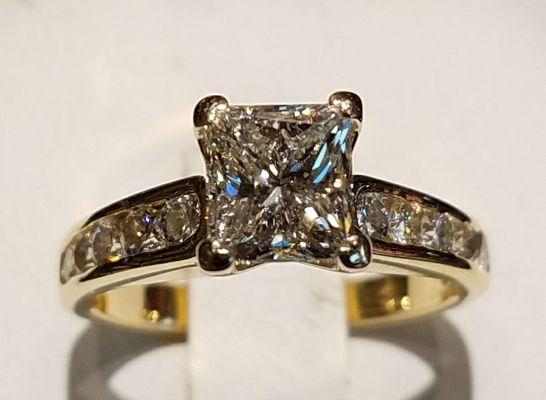 14k yellow gold classic Princess Cut center with round brilliant sides.