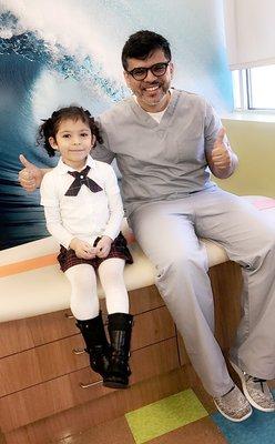 Dr. Khan with patient at Happy Chompers Pediatric Dentistry