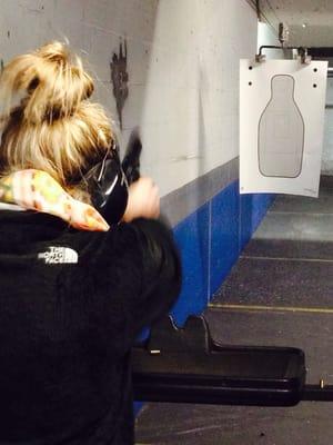 Sister shooting 9mm, first time using hand gun, Spring Break 2014 at Bullet Stop