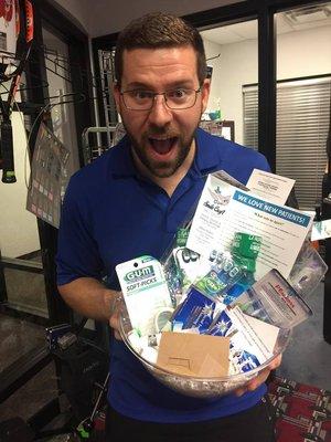 A happy patient with his giveaway basket.