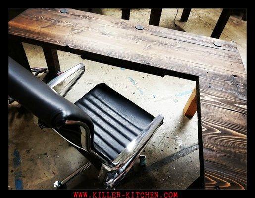 True Reclaimed desk with return a slew of grommets power strip and pen drawer