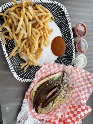 Steak gyro sandwich and a side of French fries. Ordered to go and eating at home.