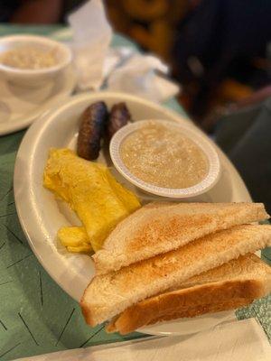 Two Eggs (Any Style), Link Sausage, Grits (Bowl) and toast.