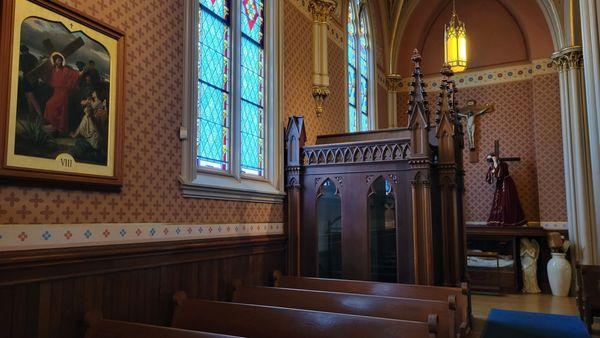 Confessional that's designed to look like a small church.