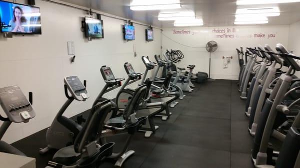 One of the many cardio rooms filled with clean, updated equipment.  Bring your headphones to plug into the "Cardio Theater"