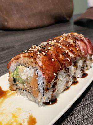 The BOMB Roll (Crab, Cucumber, Avocado, Salmon, & EEL topped w/ Seared Pepper Tuna)