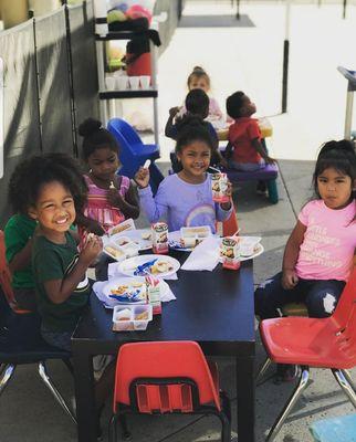 Kids enjoying they're outside picnic!!