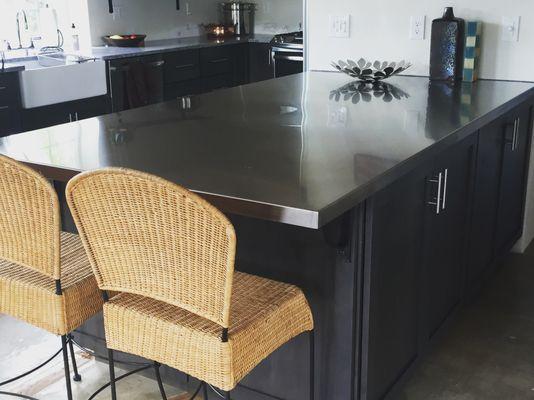 A stainless steel countertop to be the center piece of this beautiful home.