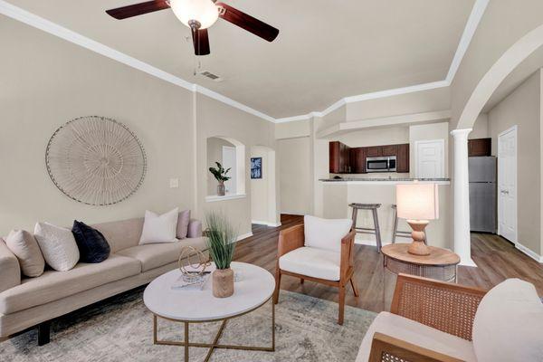 Living room with view of kitchen at The Estates of Northwoods