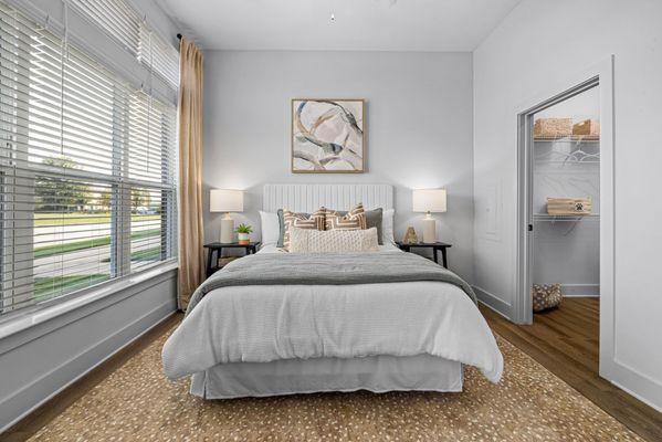 bedroom with large window and spacious closet