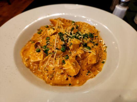 House made seafood ravioli with grilled chicken and crab sauce