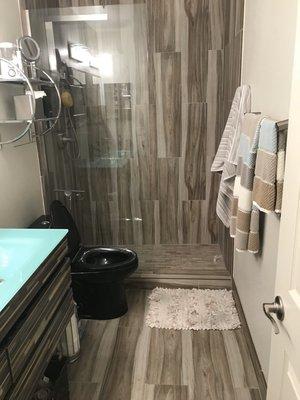 Tub removed, modern walk-in shower & bathroom remodel.