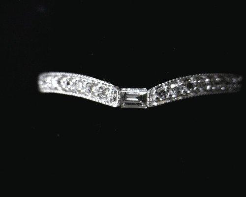 Having trouble fitting a band to your engagement ring?  We have a large assortment of curved bands!