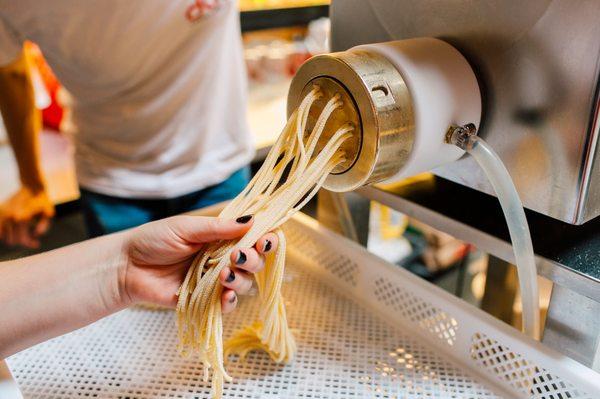 Our team at work to make fresh pasta