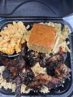 This is the oxtail dinner over cilantro and rice with smoked mac & cheese And mixed vegetables