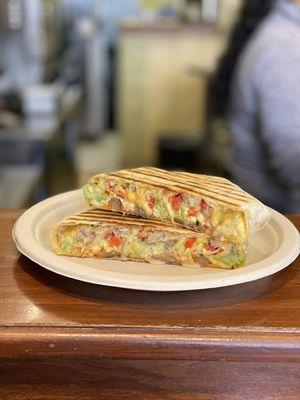 Breakfast Crunchwrap w/ sausage, roasted red peppers, avocado & onions added