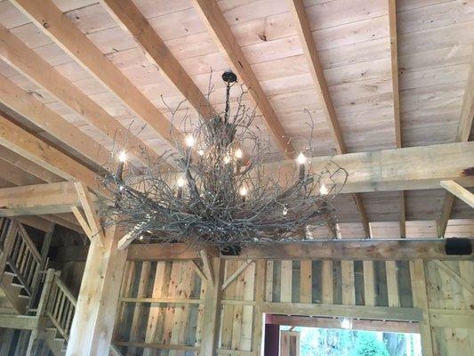 A 6ft branch chandelier installed 15 feet in the air in a resturant.