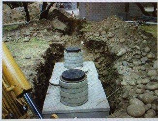 Installed septic tank with risers