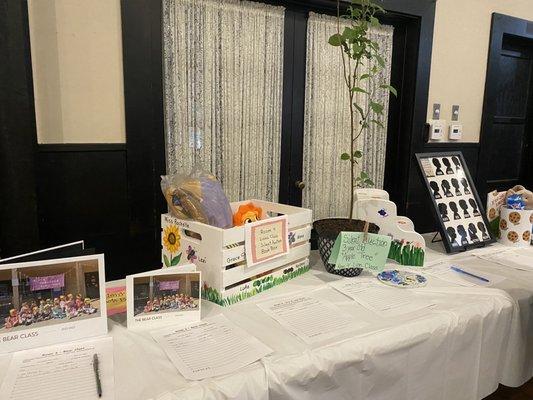 Open House Silent Auction table! Funds raised go towards children's enrichment program.