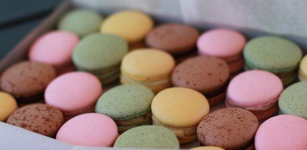 French macarons made in the store. Chocolate, Lemon, Raspberry, and Pistachio!