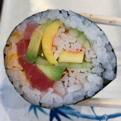 Caribbean Roll: Mango, crab, tuna, masago, cucumber, avocado and spicy sauce.