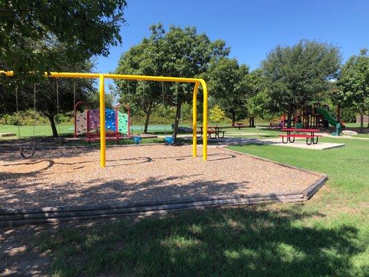 Swings, climb scape and picnic tables