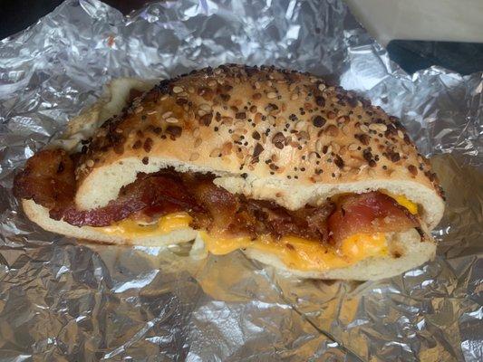 Everything bagel scooped out with bacon, egg, and cheese