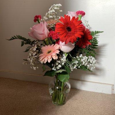 Arrangement i made with the flowers and vase purchased from this place