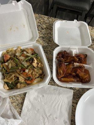 Drunken Noodle and chicken wings with hot level sauce