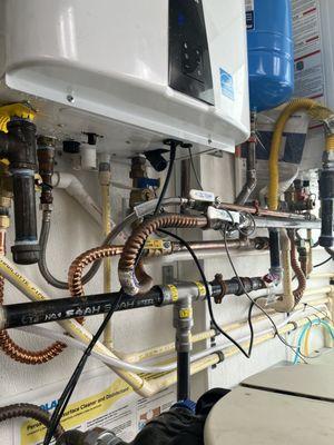 Tankless water heater piping for multiple units.