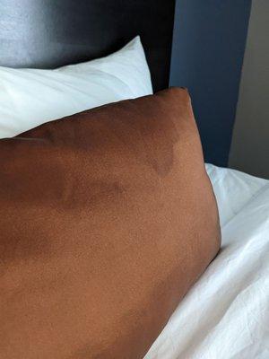 Stains on the pillow.