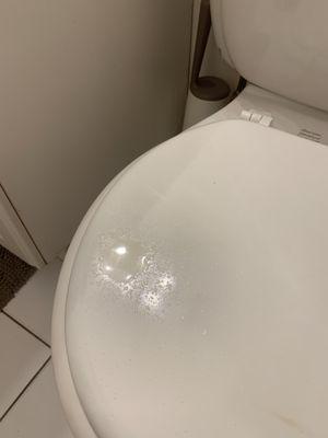 toilet with drops from ceiling