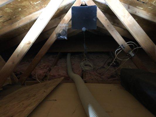 The hose going into the attic through the garage access.