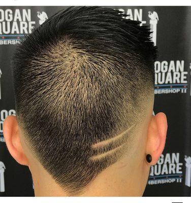 Clean V haircut with a bold fade on the sides