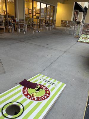 Outside seating with corn hole game