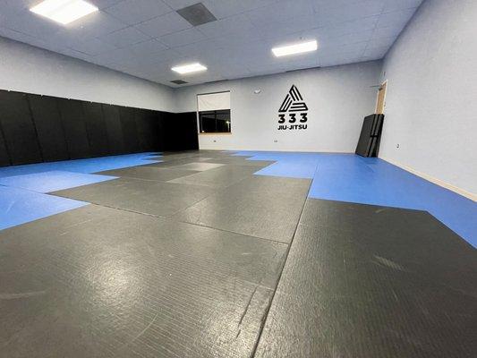 Wide angle shot of the gym and mats