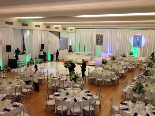 White Fabric 16' Tall.  High Gloss white Dance Floor, SIlver Chiavari Chairs, floor length linen, lounge furniture in white