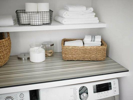 Laundry room folding table and storage shelf.