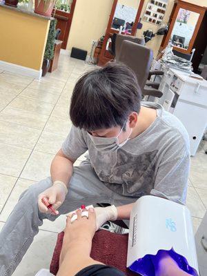 Michale taking his time with my pedicure