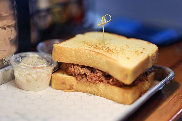 Pulled pork brisket sandwich