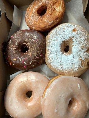 Top and then clockwise: Churro, French toast, 2 glazed, and chocolate sprinkles. Delicious!