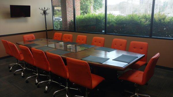 The Board Room is professionally designed and furnished with a conference table that seats up to fourteen.