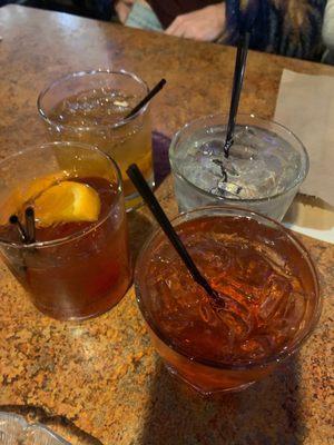 Two Old-Fashioneds and a couple of other drinks.